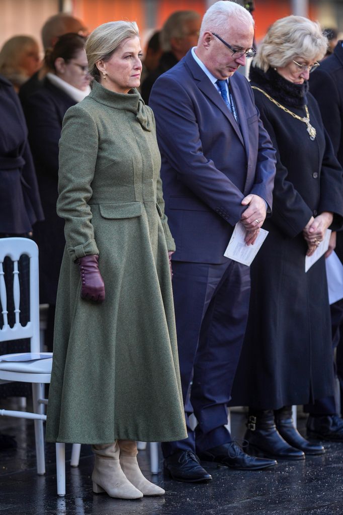 Sophie, Duchess of Edinburgh stood among people in khaki coat dress