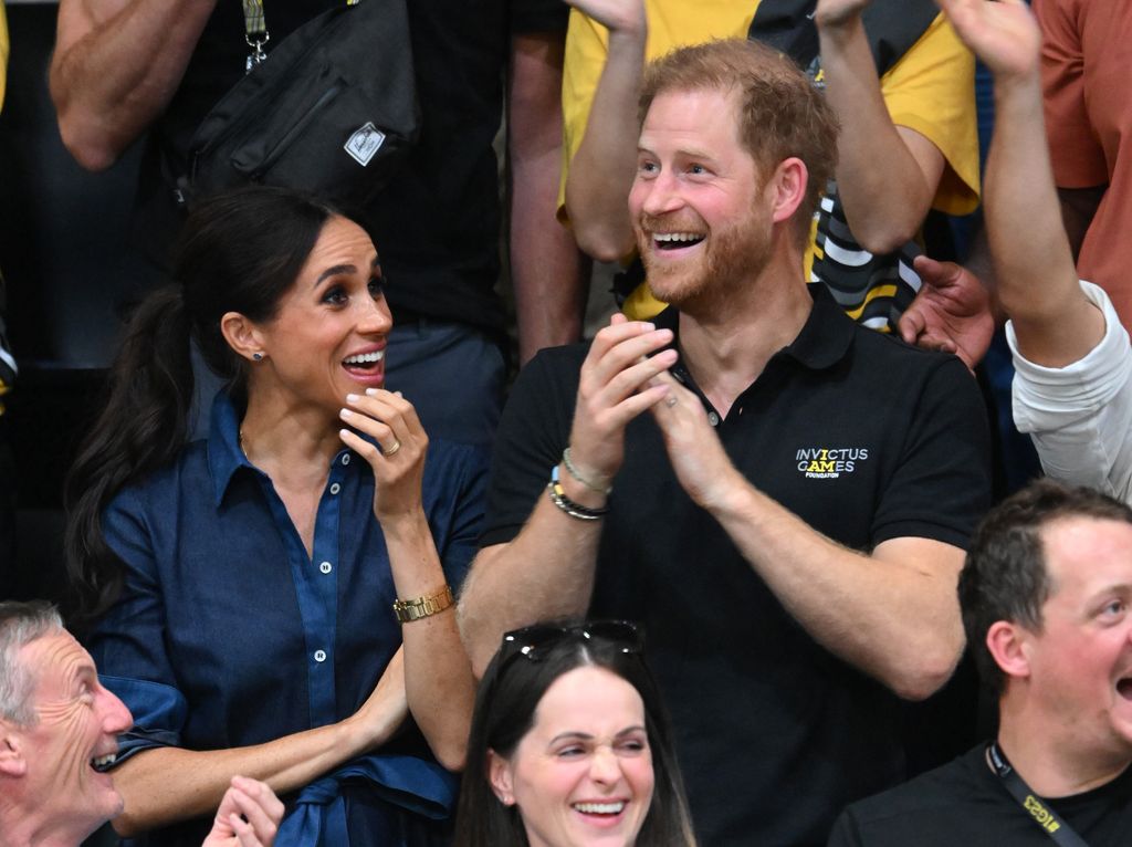 Meghan Markle and Prince Harry applauding