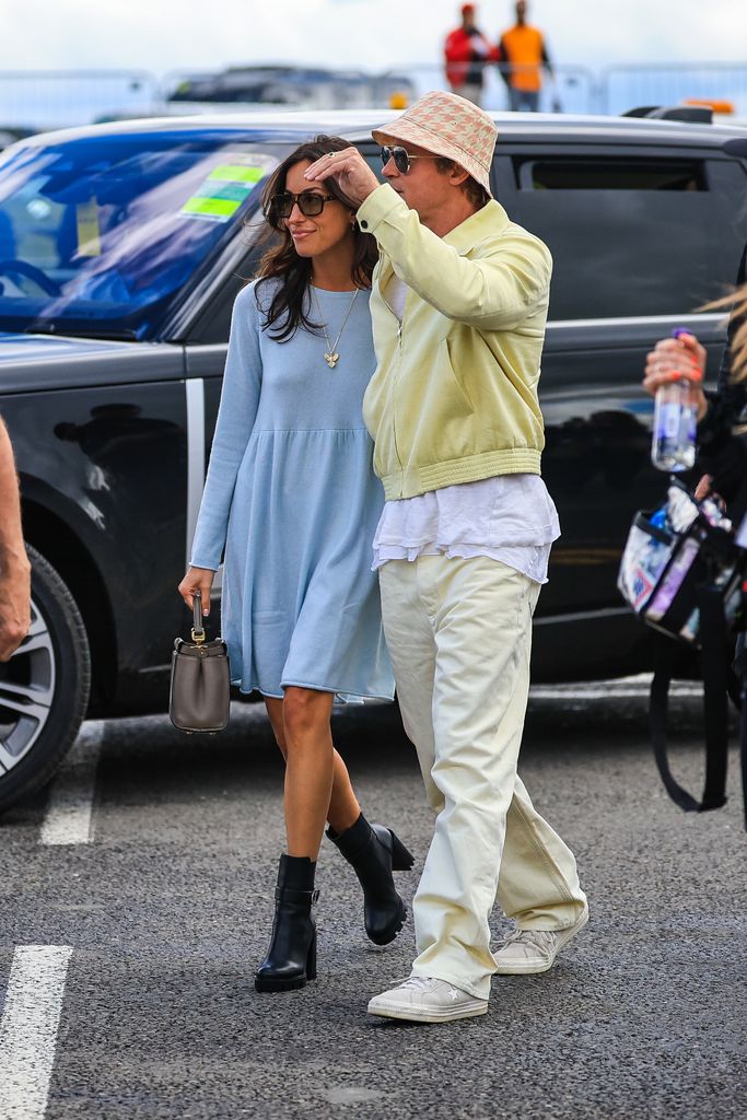 Brad Pitt, star of upcoming 'F1' movie, arrives in the paddock with girlfriend Ines de Ramon during the F1 Grand Prix of Great Britain at Silverstone Circuit on July 7, 2024 in Northampton, United Kingdom