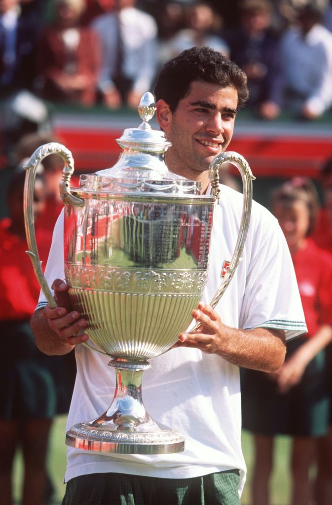 Pete Sampras holds up trophy at Queens in 1995