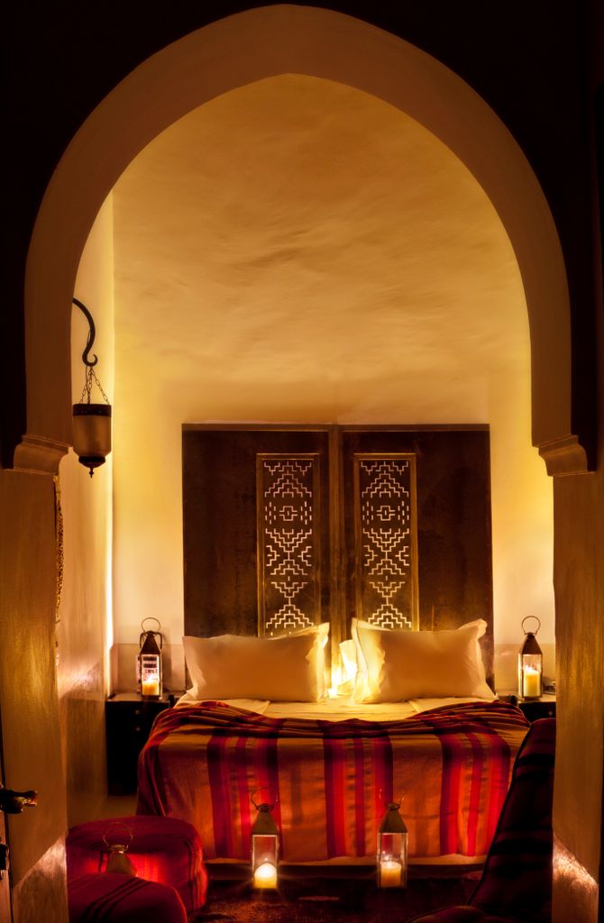 Night shot of cosy bedroom set up at Le Farnatchi in Marrakech 