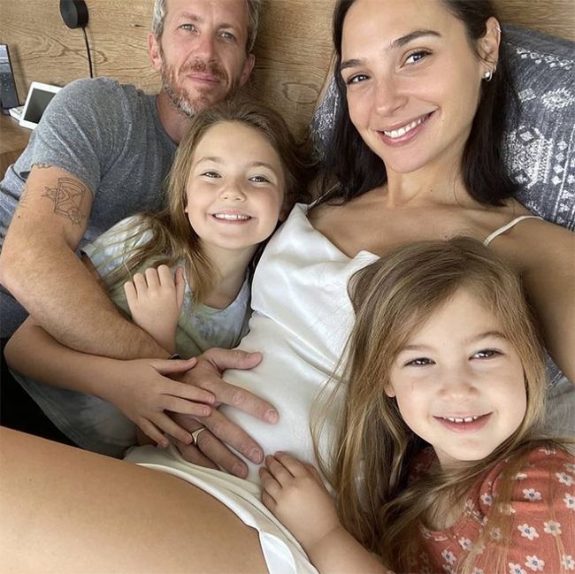 gal gadot lying in bed with family