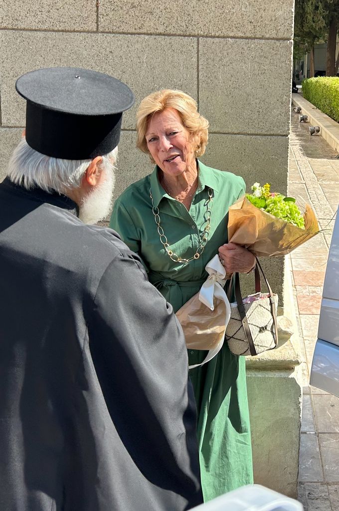 Queen Anna Marie received flowers upon her arrival