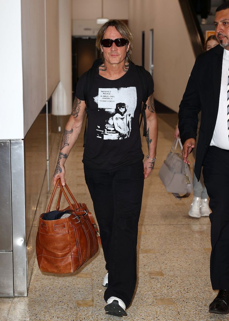 Keith Urban pictured on arrival into Sydney ahead of Christmas


