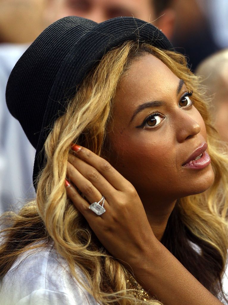 Beyonce with hand up showing ring