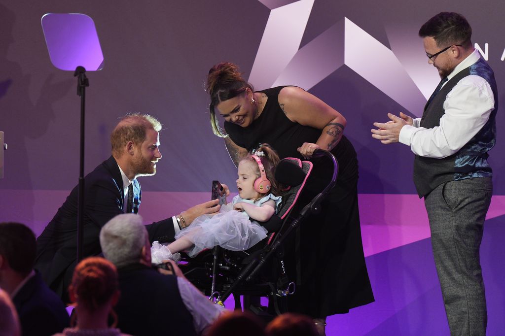 Harry presenting the Inspirational Child 4-6 award to six-year-old Esmee