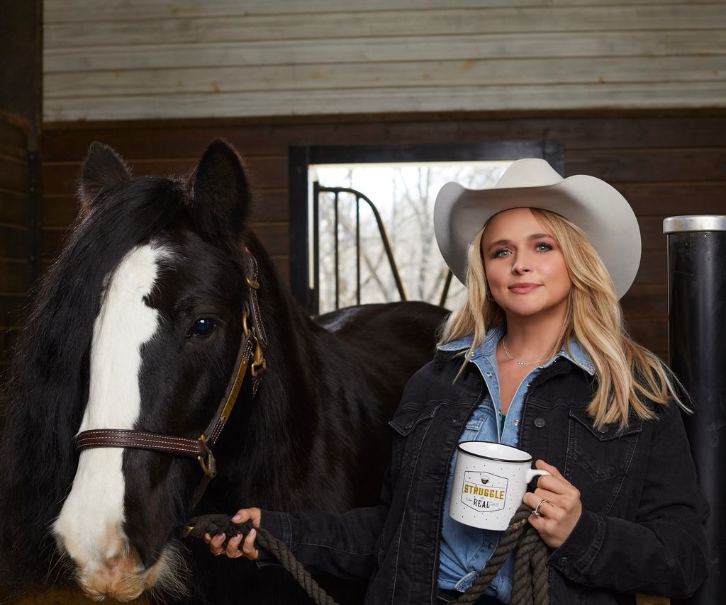 photo of miranda lambert with horse inside her barn