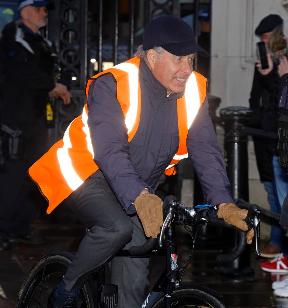 David Armstrong-Jones cycling in orange hi-vis jacket