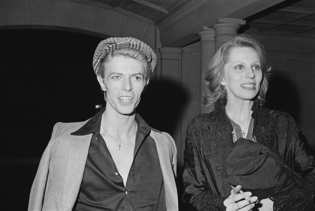 David Bowie (1947 - 2016) and hs wife Angie, at a reception given by the American Film Institute for film director Michelangelo Antonioni at Greystone Mansion, Beverly Hills, California, April 1975. (Photo by Michael Ochs Archives/Getty Images)