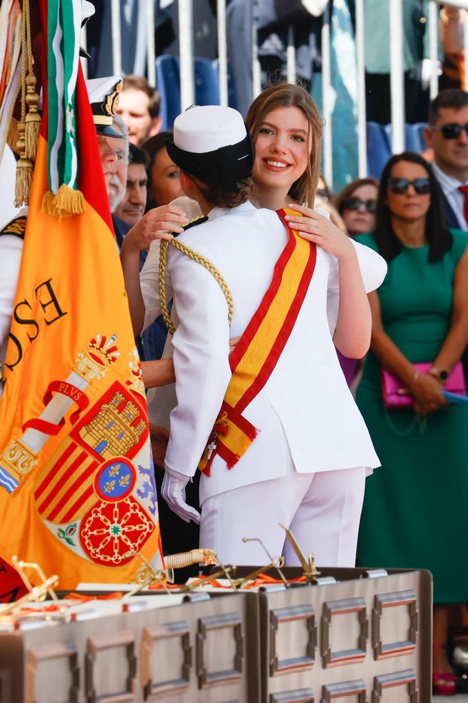 Infanta Sofia hugging Princess Leonor at naval ceremony