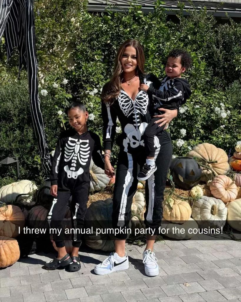 Khloe Kardashian with her two kids in skeleton outfits