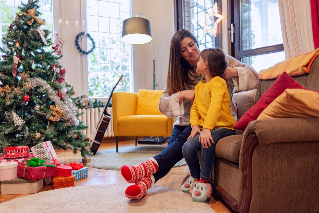 mother and daughter in home at christmas