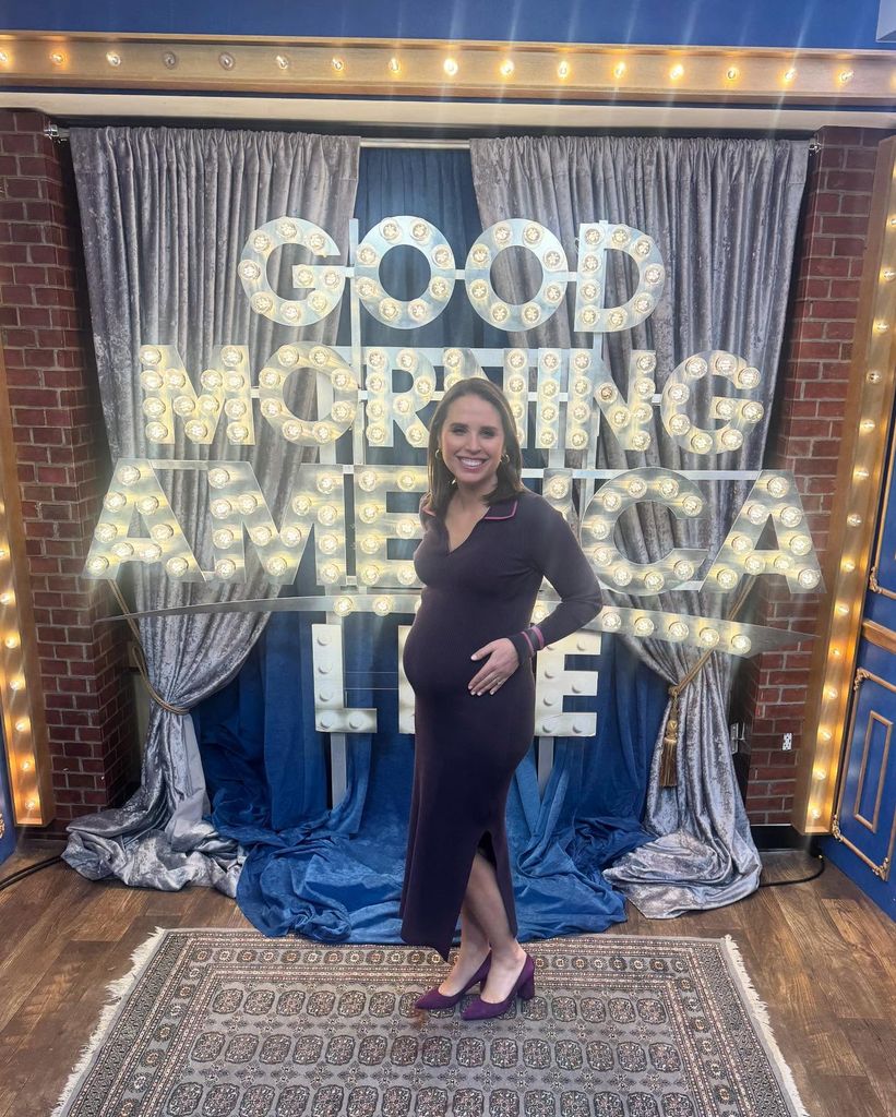 elizabeth schulze in front of gma live sign holding baby bump