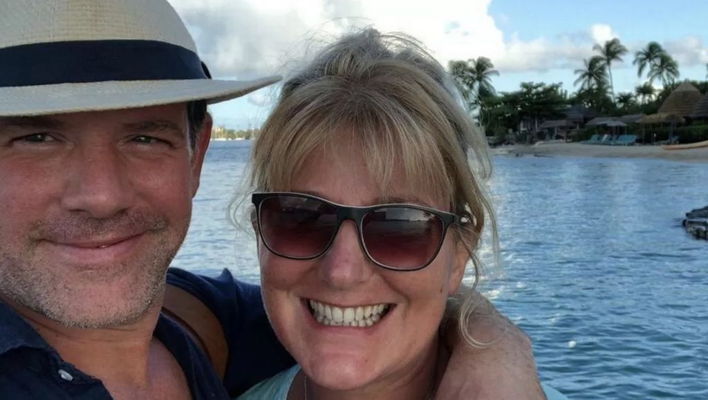 Matt Tebbutt and wife Lisa smiling in front of the sea