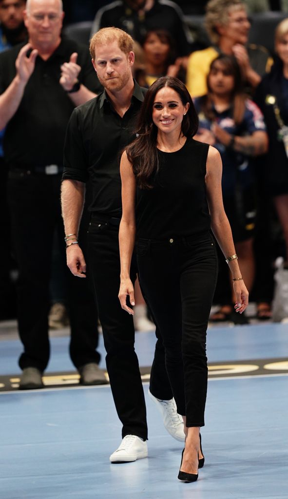 Meghan Markle wearing black Le Color skinny jeans by Frame at the Invictus Games