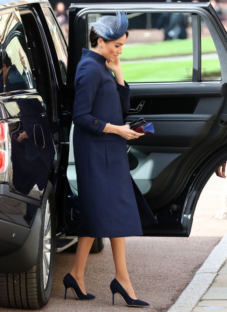 The Duchess of Sussex wearing custom Givenchy to the wedding of Princess Eugenie and Jack Brooksbank