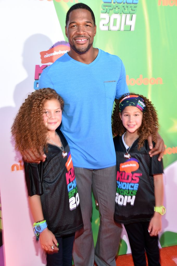 Host Michael Strahan (C) with daughters Sophia Strahan and Isabella Strahan attend Nickelodeon Kids' Choice Sports Awards 2014 at UCLA's Pauley Pavilion on July 17, 2014 in Los Angeles, California.