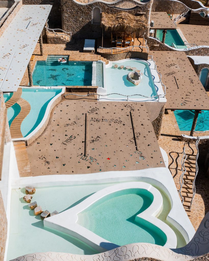 Calilo suite created from rooms with three large swimming pools one in the shape of a heart