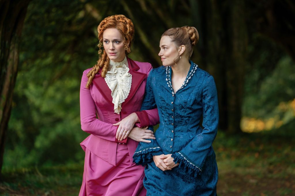 Christina Hendricks and Kristine Froseth in period costumes in woods