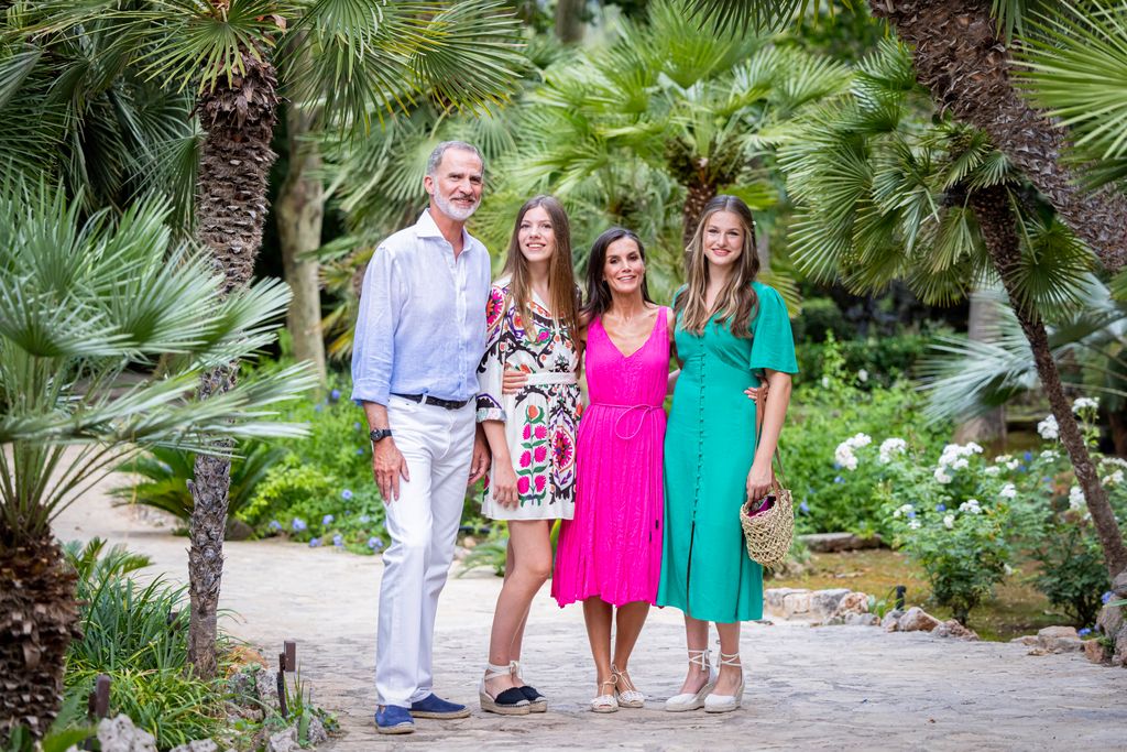 Letizia with husband and kids in leafy surroundings
