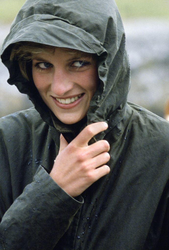 Diana Princess of Wales wearing a waterproof Barbour style jacket in the rain during a visit to the Western Isles of Scotland, 4th July 1985.