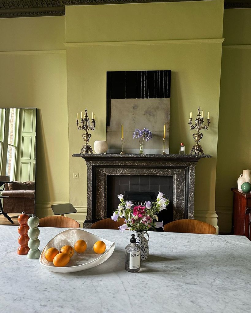 Stacey Dooley's living room is decorated in a chic pistachio green