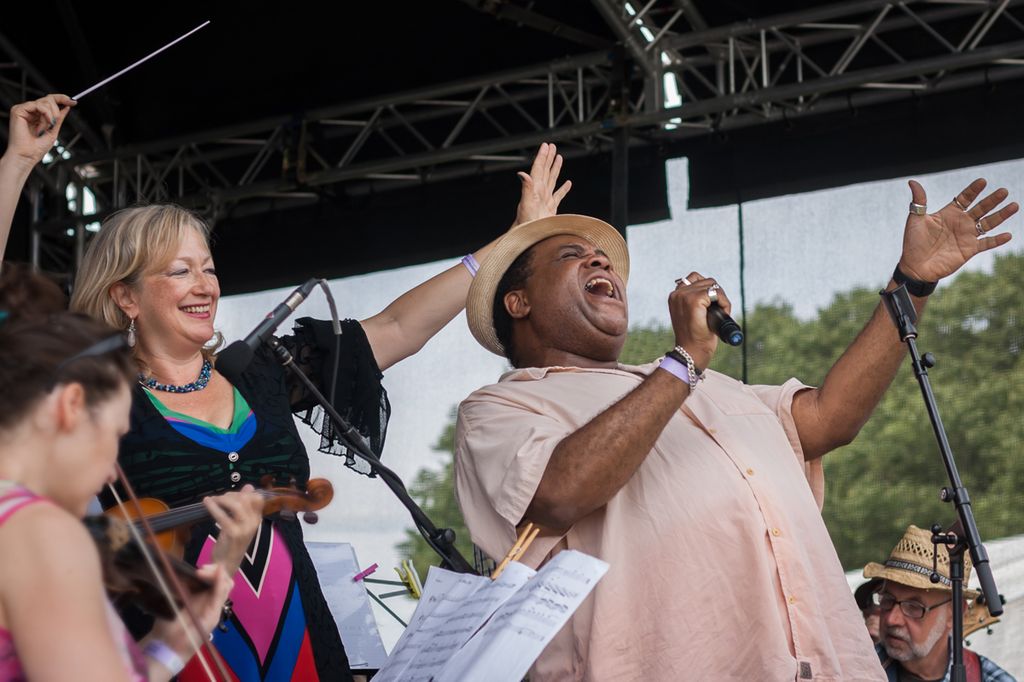 A photo of Clive performing for the charity at the 2015 Walthamstow Garden Party 