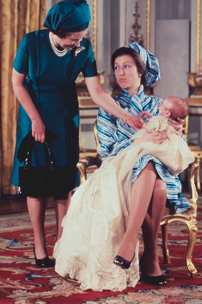 Queen Elizabeth II with her daughter, Princess Anne and grandson, Peter Phillips at the baby boy's christening on 12th December 1977.