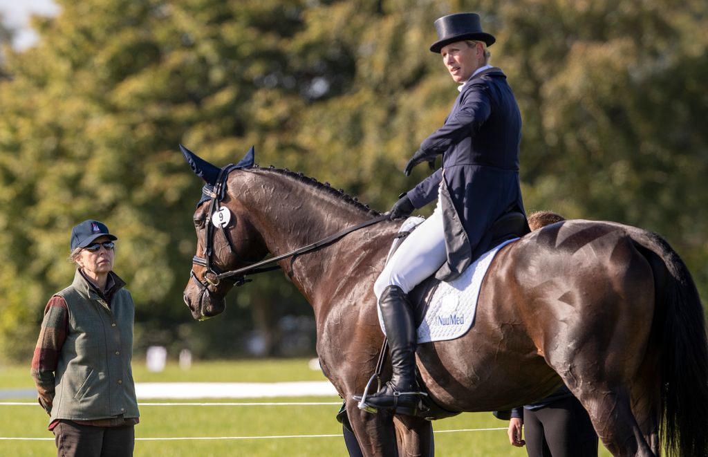 Princess Anne talks to Zara Tindall atop her horse