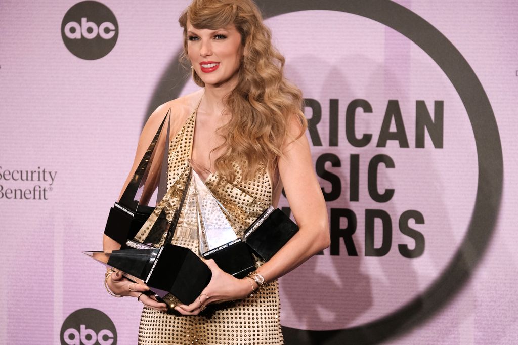 Taylor Swift, winner of Favorite Pop Album, Favorite Female Pop Artist, Favorite Music Video, Favorite Country Album, Favorite Female Country Artist, and Artist of the Year, poses in the press room at the 2022 American Music Awards