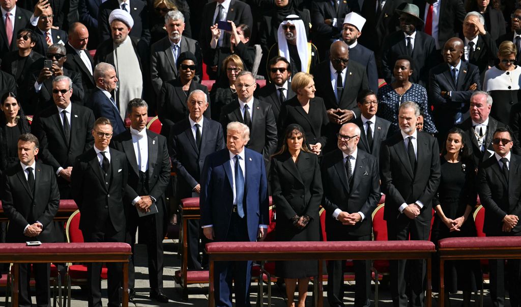 US President Donald Trump and First Lady Melania Trump stand alongside leaders including France's President Emmanuel Macron and Finland's President Alexander Stubb