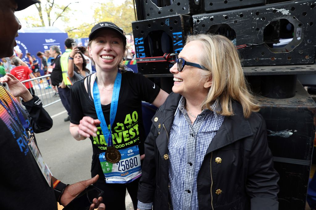 Chelsea Clinton talks with mom Hillary Clinton after crossing the finish line of the TCS 2022 New York City Marathon on November 06, 2022 in New York City.