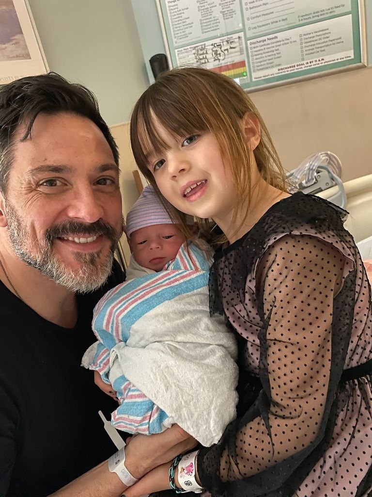 Steve Kazee with his newborn son and stepdaugher Everly