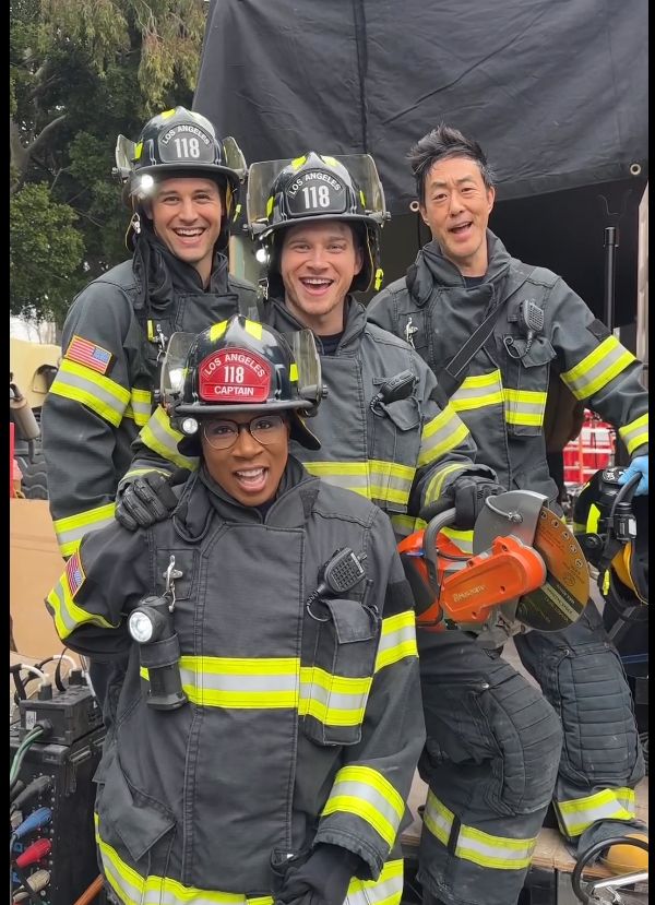 Aisha Hinds wears a Captain's fire hat on set of 9-1-1