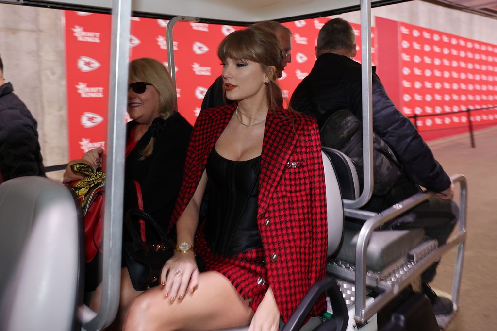 Taylor Swift rides on a golf cart prior to a game between the Kansas City Chiefs and the Denver Broncos 