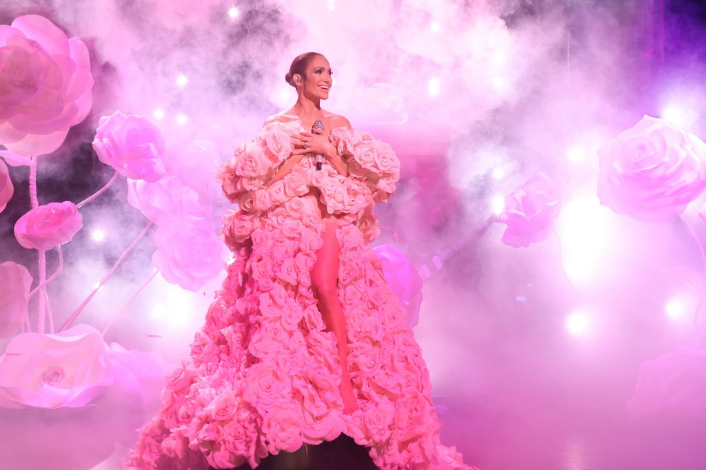 Jennifer Lopez performing in pink ruffle dress