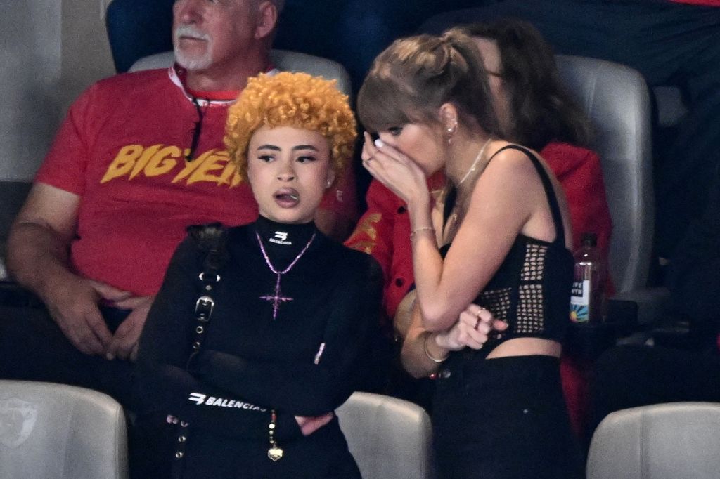 US singer-songwriter Taylor Swift (R) speaks to US rapper Ice Spice during Super Bowl LVIII between the Kansas City Chiefs and the San Francisco 49ers at Allegiant Stadium in Las Vegas, Nevada, February 11, 2024