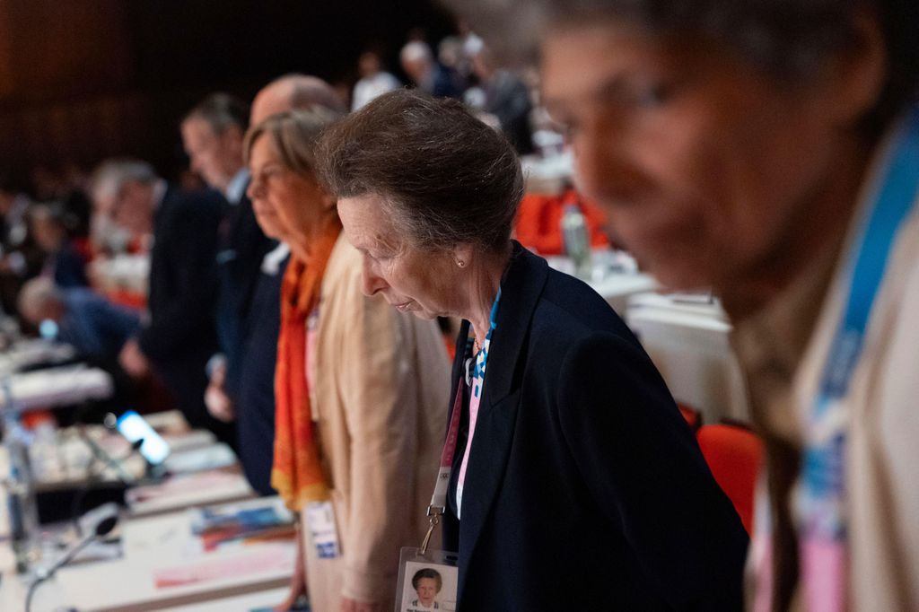 Princess Anne observes a moment of silence to remember Olympic officials who died in the past year during the start of the 142nd IOC session