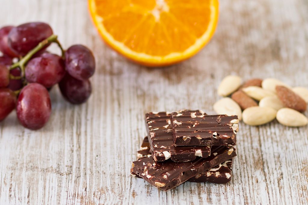 Pieces of dark chocolate with almonds and fruits