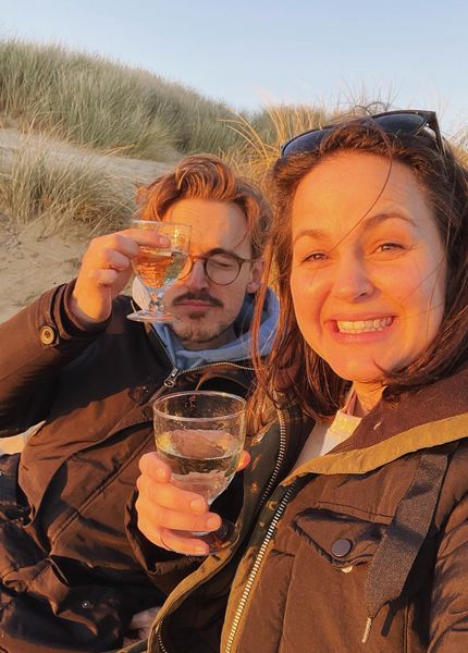 giovanna fletcher and tom drinking wine on beach in east sussex