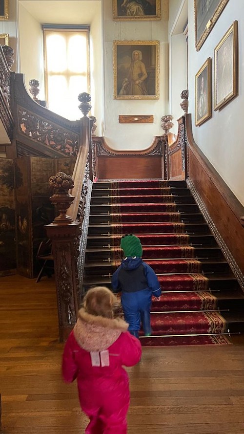 A photo of Wilfred and Romy climbing the stairs 