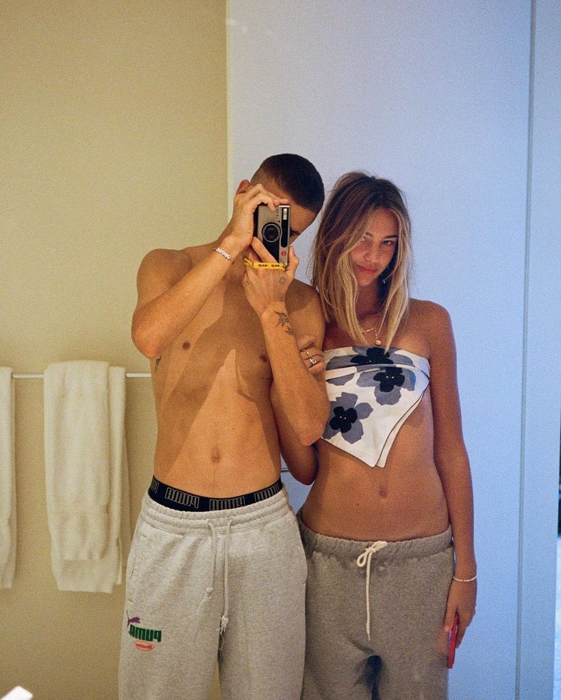 Mia and Romeo Beckham posing in a mirror selfie 
