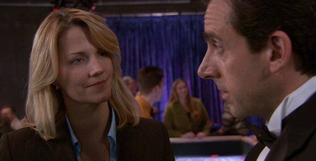 blonde woman looking at man in suit