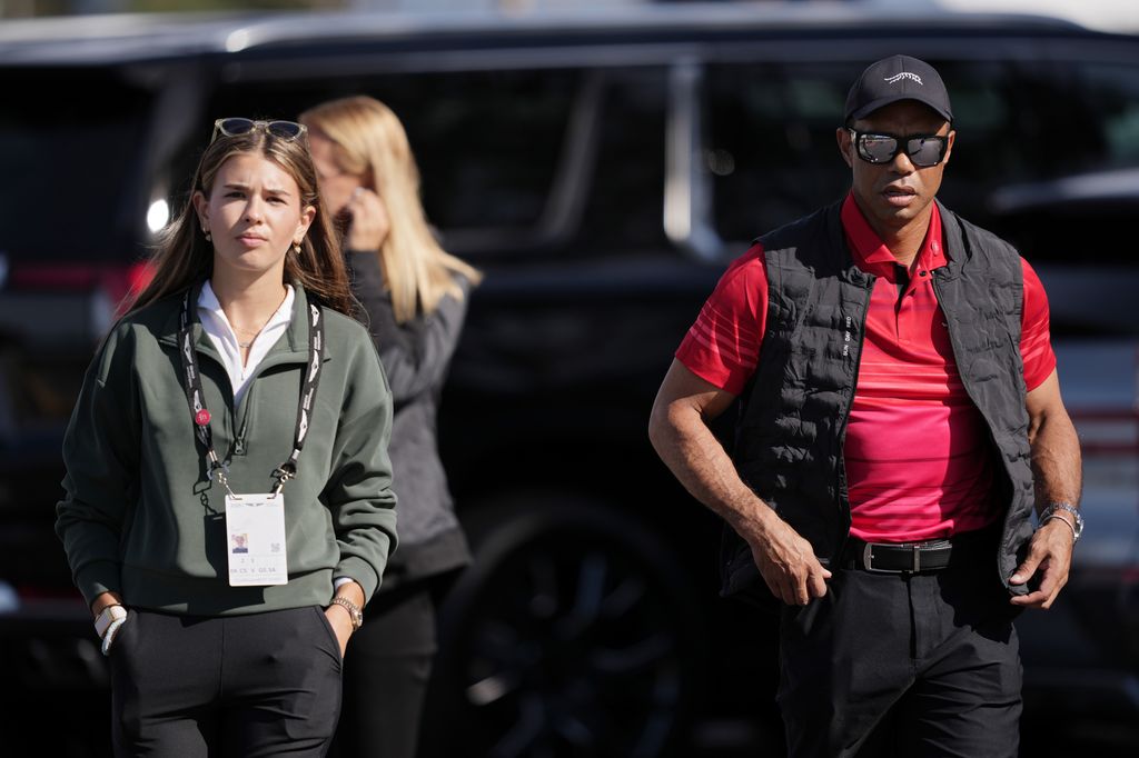 Kai Trump (L) and Tiger Woods arrive to the course during the final round of The Genesis Invitational 2025 at Torrey Pines Golf Course on February 16, 2025 in La Jolla, California