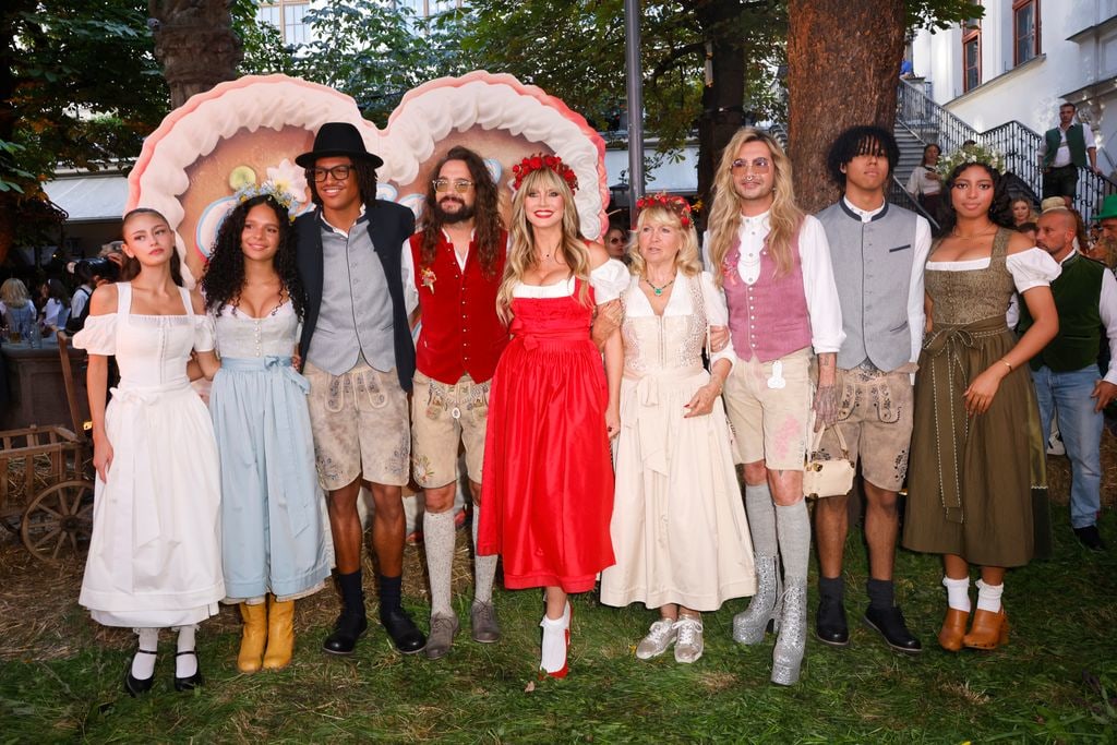 Leni Klum, Kayla Betulius, Henry Samuel, Tom Kaulitz, Heidi Klum, Erna Klum, Bill Kaulitz, Johan Samuel and Lou Klum pose together during the red carpet for Heidifest By Heidi Klum
