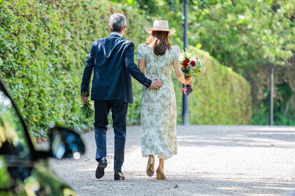 Frederik puts his arm around Mary 