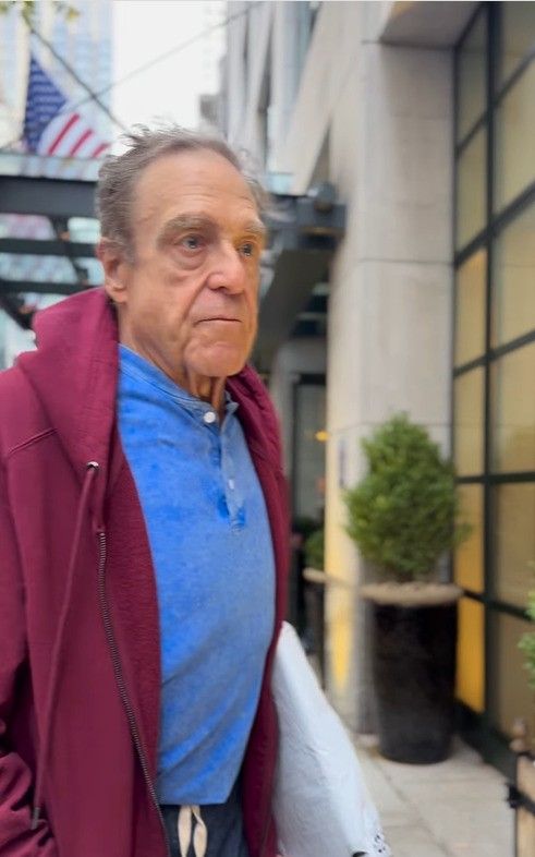 photo of john goodman in blue top and red hoodie after weight loss