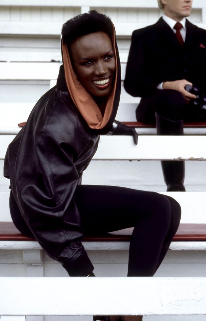 Jamaican-American model Grace Jones, is May Day, dressed in costume, sits in the stands at Royal Ascot Racecourse during the filming of the 1985 James Bond spy movi