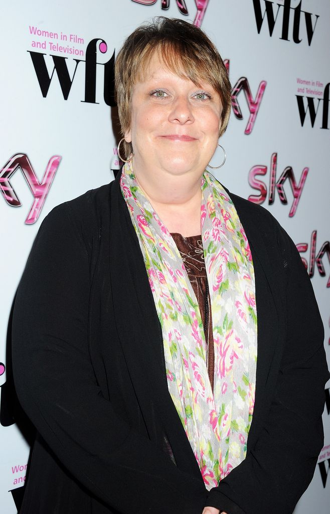 Kathy burke smiling in black cardigan