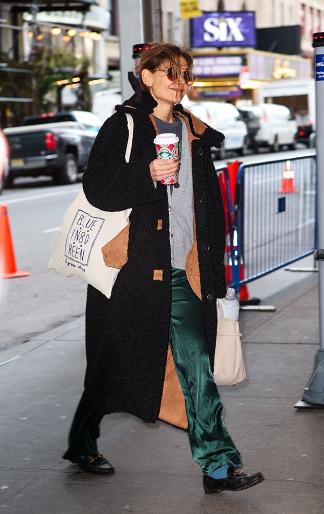 Katie Holmes arrives at her Broadway play in satin pants and a stylish teddy coat